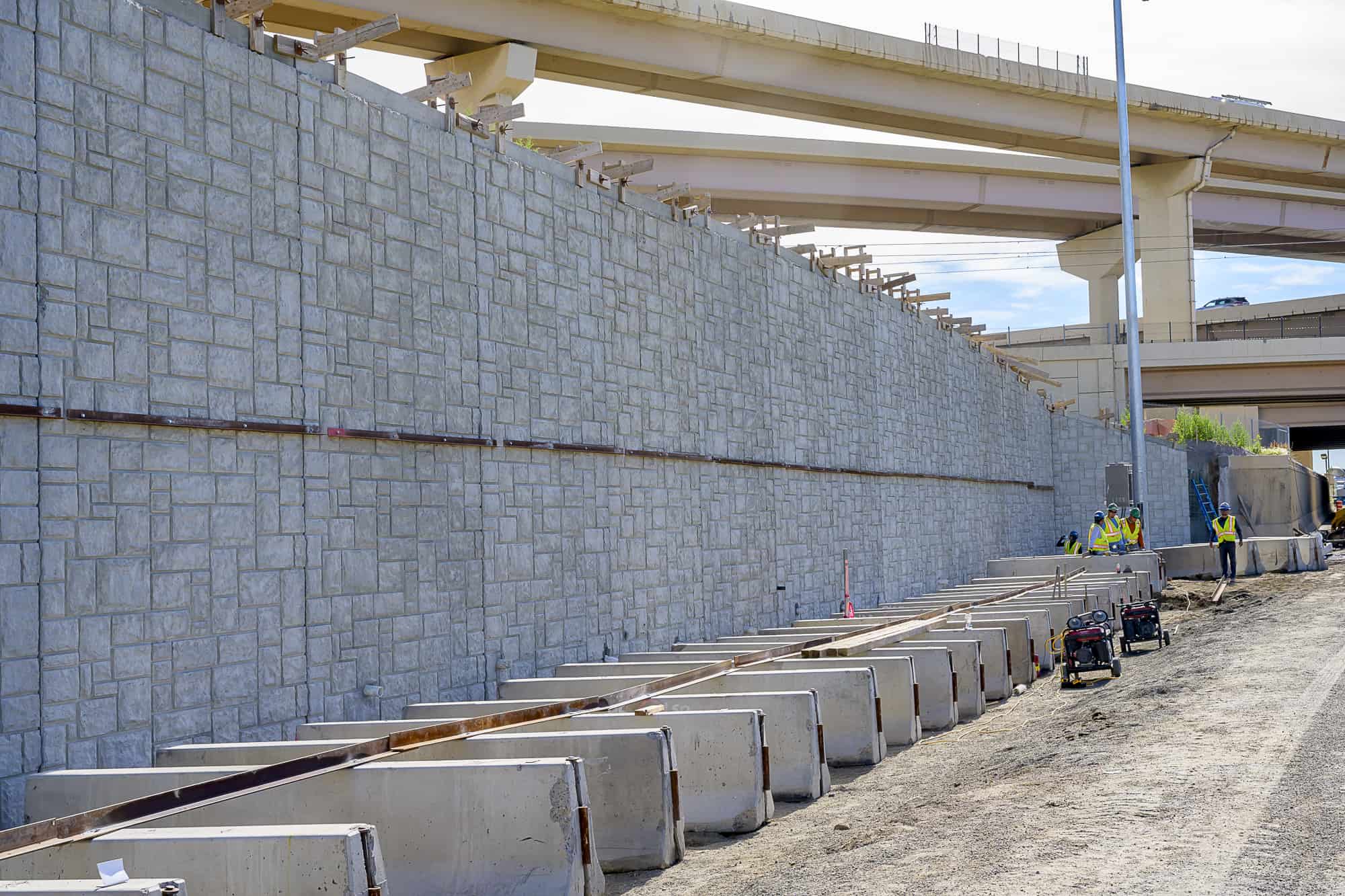 Soil nail wall with architectural concrete fascia